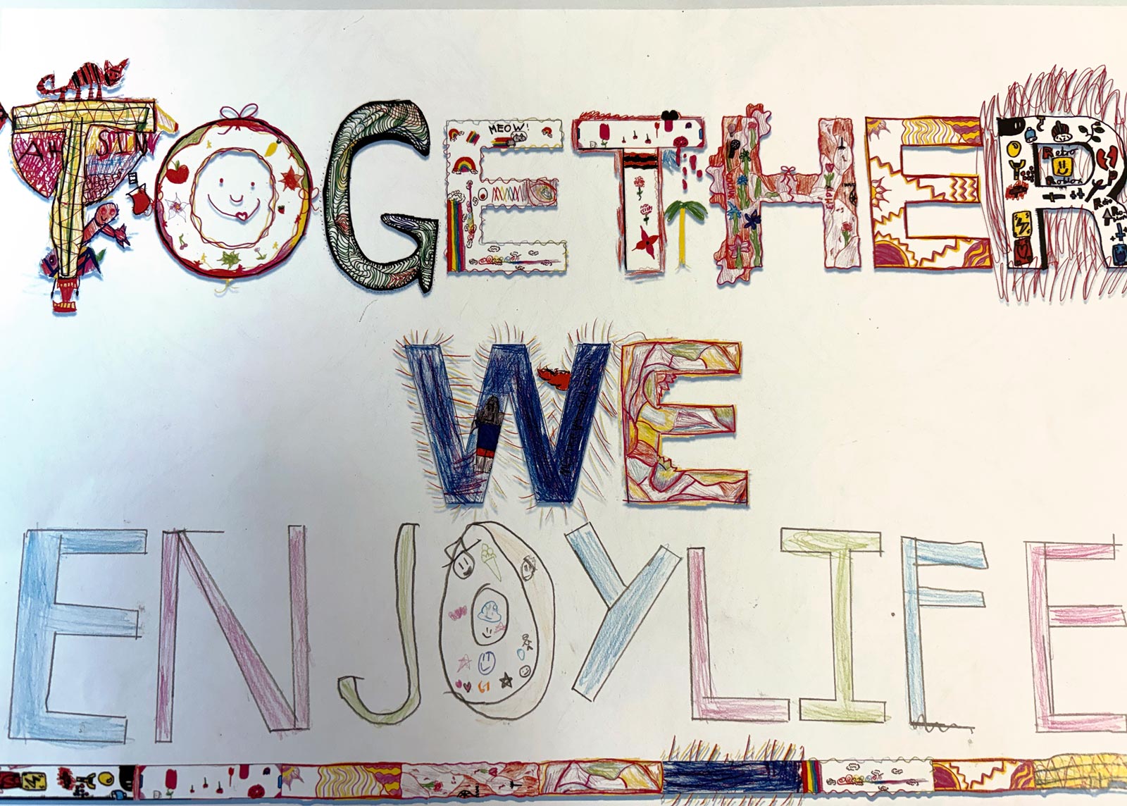 A child's reworking of what Together We might mean. In this instance they have written Together We "enjoy life".